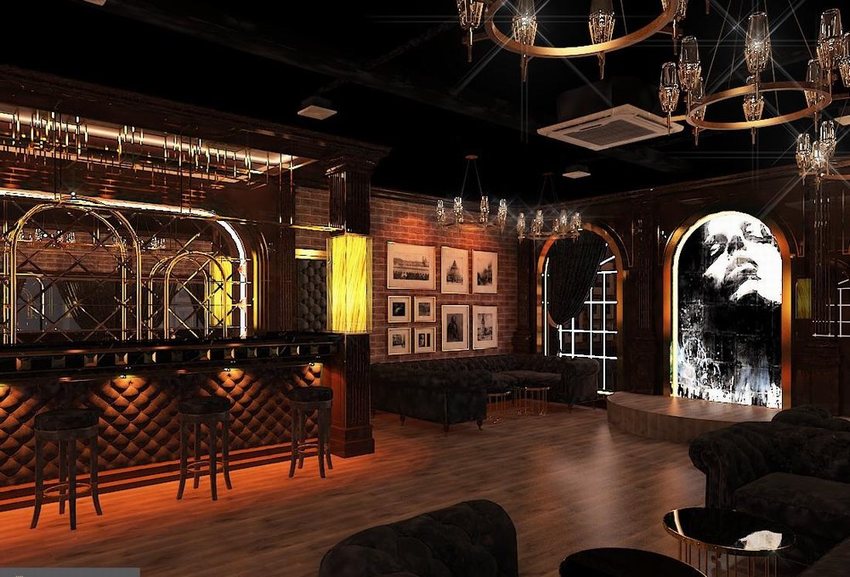 Mẫu thiết kế cafe bar phong cách cổ điển châu Âu với quầy bar ốp gỗ, gương trang trí và đèn tường ánh vàng sang trọng. Không gian nội thất sử dụng chất liệu da, gỗ và ánh sáng ấm mang lại cảm giác đẳng cấp và ấm cúng.