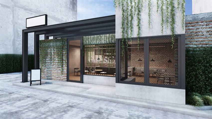 Thiết kế thi công quán cafe khung thép hiện đại với phong cách tối giản, kết hợp mảng xanh treo tạo không gian thoáng đãng, trẻ trung và ấn tượng.