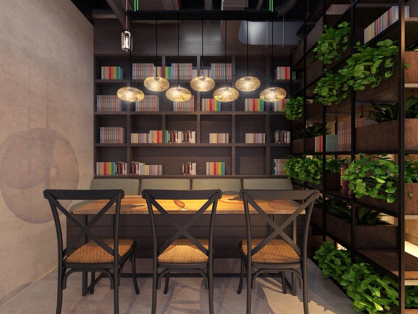 Thiết kế quán cafe đọc sách hiện đại, không gian yên tĩnh với kệ sách lớn, bàn gỗ dài và cây xanh trang trí.