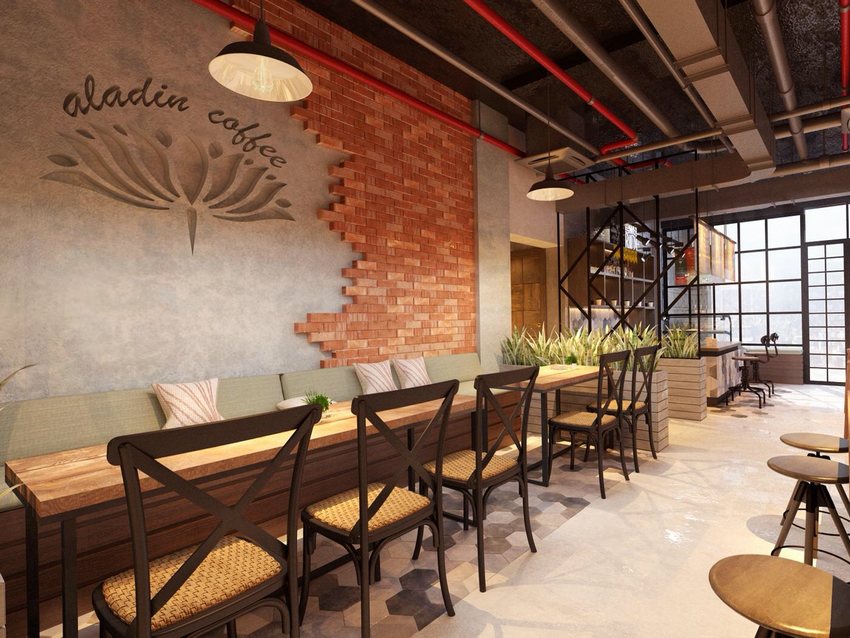 Thiết kế quán cafe phong cách Industrial hiện đại với tường gạch thô, bàn ghế gỗ và ánh sáng tự nhiên thoáng đãng.