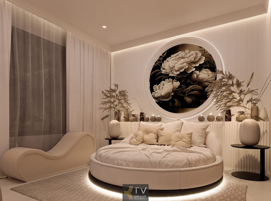 Thiết kế phòng khách sạn hiện đại với giường tròn, đèn LED chân giường và nội thất cao cấp tạo điểm nhấn nổi bật cho không gian lưu trú 