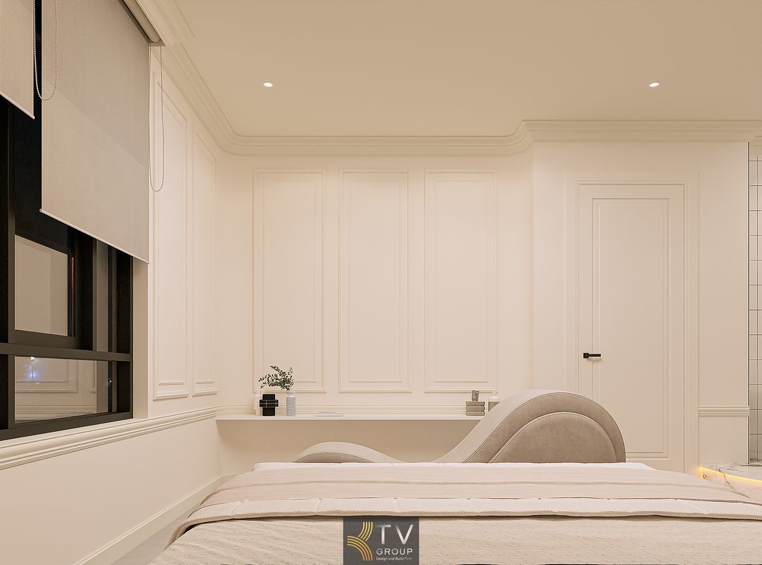 Không gian phòng khách sạn với giường bo cong và tone màu be nhẹ nhàng 