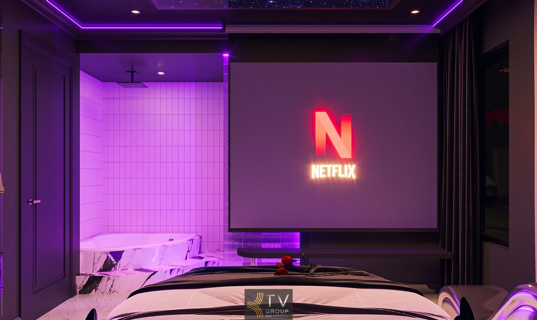 Thi công phòng khách sạn với nội thất bo cong cao cấp, giường trung tâm và ánh sáng tím chủ đạo giúp không gian trở nên khác biệt và cuốn hút. 