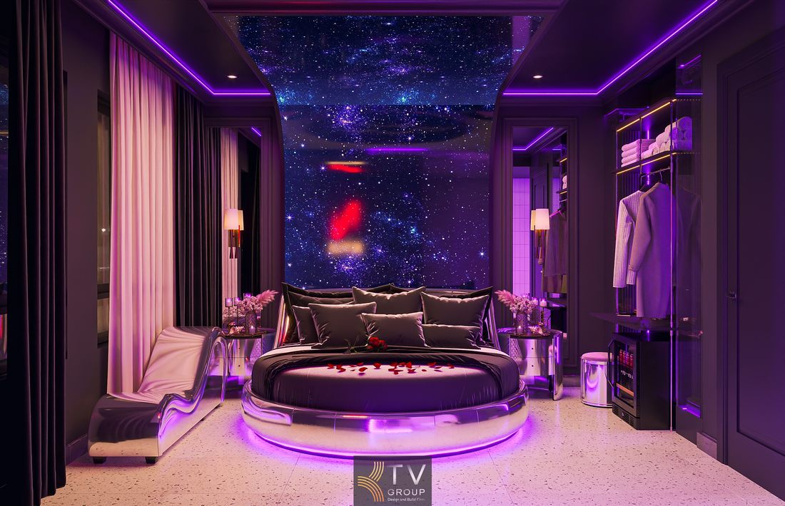 Thiết kế phòng khách sạn hiện đại với tường trang trí bầu trời sao và hệ đèn LED đa lớp, tạo chiều sâu không gian và cảm giác thư giãn cao cấp. 