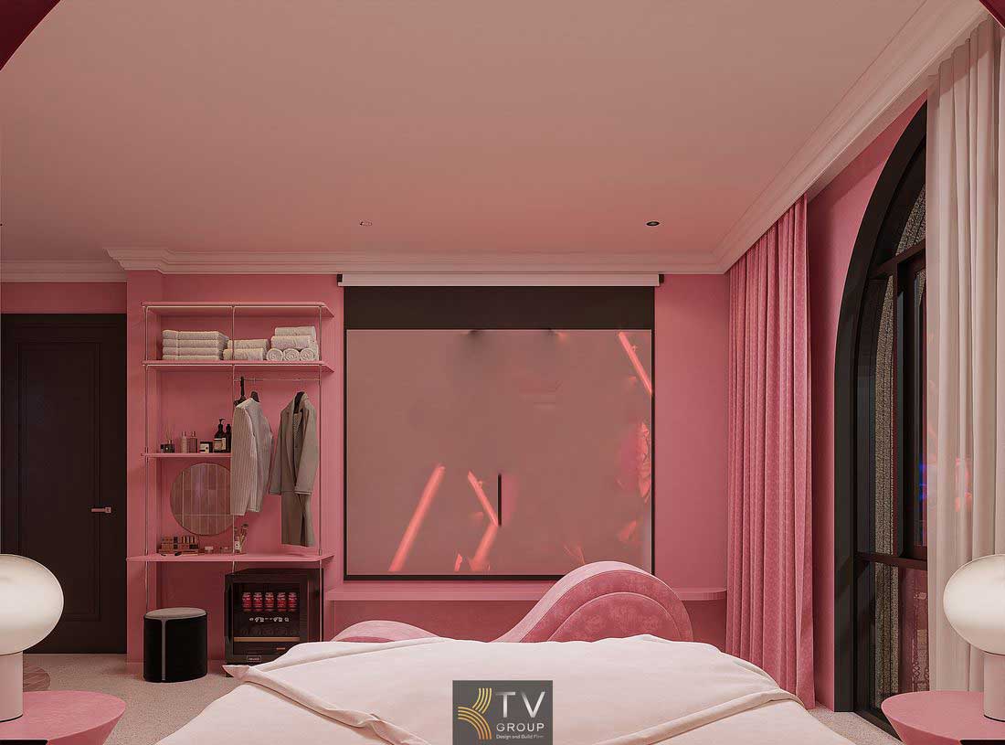 Phòng khách sạn thiết kế tông hồng pastel kết hợp ánh sáng gián tiếp tạo cảm giác ấm áp và trải nghiệm riêng tư