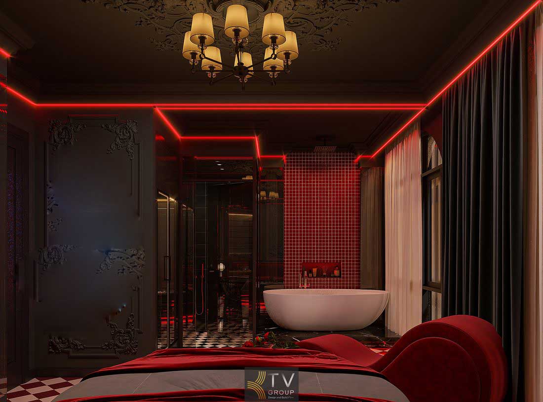 Thi công phòng khách sạn với ghế thư giãn bo cong, giường trung tâm và ánh sáng LED tạo chiều sâu không gian