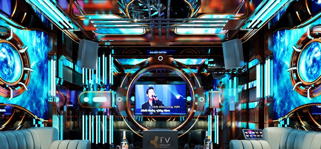 Phòng karaoke KTV thiết kế phong cách sci-fi với hiệu ứng ánh sáng xanh, màn hình lớn và chi tiết kim loại tạo cảm giác như không gian tàu vũ trụ. 
