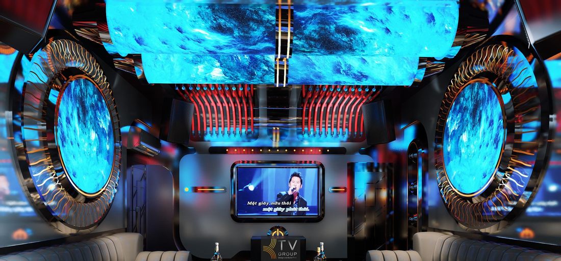 Phòng karaoke KTV tại Tây Ninh thiết kế phong cách futuristic với trần ống LED, màn hình giải trí hai bên và sofa cong cao cấp, tạo không gian âm nhạc sống động cho mô hình karaoke kinh doanh hiện đại. 