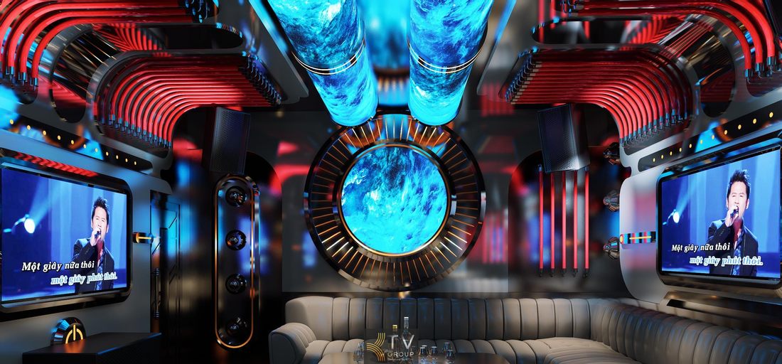 Thiết kế nội thất phòng karaoke tại Tây Ninh nổi bật với hệ ánh sáng đỏ, màn hình lớn và bố cục ghế sofa bao quanh, mang lại trải nghiệm giải trí hiện đại và không gian hát nhóm sang trọng. 