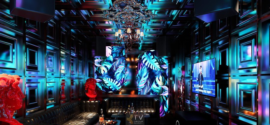 Thiết kế thi công phòng karaoke Luxury Tropical Bảo Lộc với nội thất da đen, ánh sáng xanh tím và tranh LED lá cây, tạo không gian thư giãn nhưng vẫn đẳng cấp và cuốn hút. 