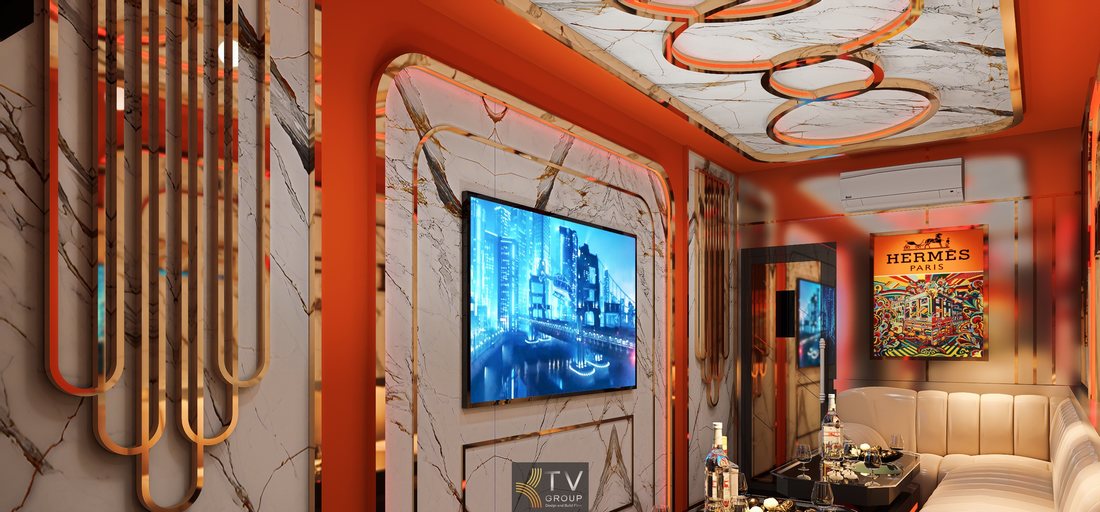 Không gian karaoke Hermès Paris sử dụng marble trắng vân vàng, nội thất sofa dài màu kem, ánh sáng LED viền và bố cục gọn gàng phù hợp mô hình karaoke cao cấp tại TPHCM.