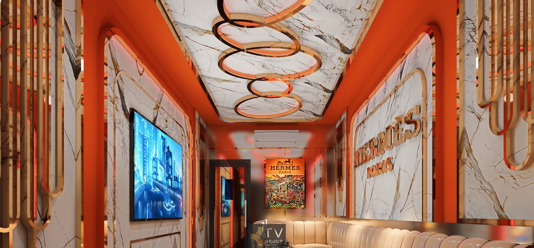 Mẫu phòng karaoke KTV Hermès Paris với thiết kế tường đá marble sang trọng, logo nổi bật, màn hình âm tường và hệ ánh sáng LED tạo hiệu ứng hiện đại và đẳng cấp.