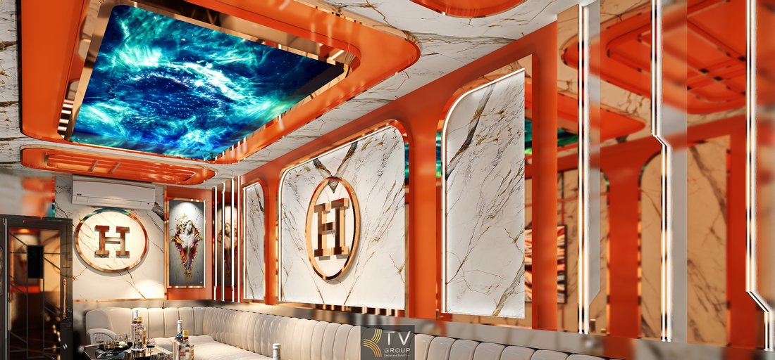 Thiết kế phòng karaoke Hermès Paris với trần LED galaxy ấn tượng, tường đá marble cao cấp, sofa sáng màu và hệ ánh sáng hiện đại tạo không gian KTV sang trọng. 