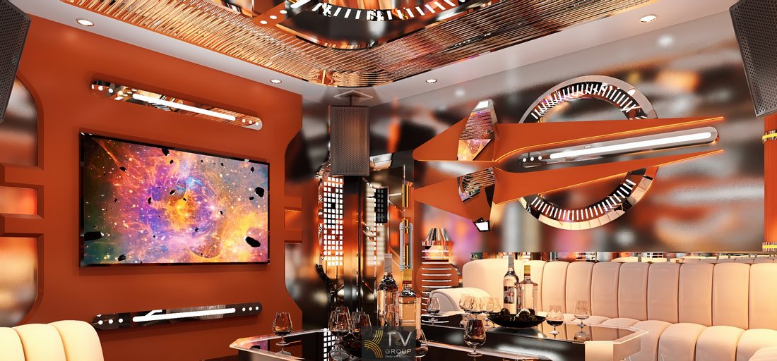 Không gian karaoke cao cấp phong cách futuristic với tường cam ánh kim, chi tiết kim loại phản chiếu và hệ đèn LED đa lớp mang đến trải nghiệm giải trí hiện đại.