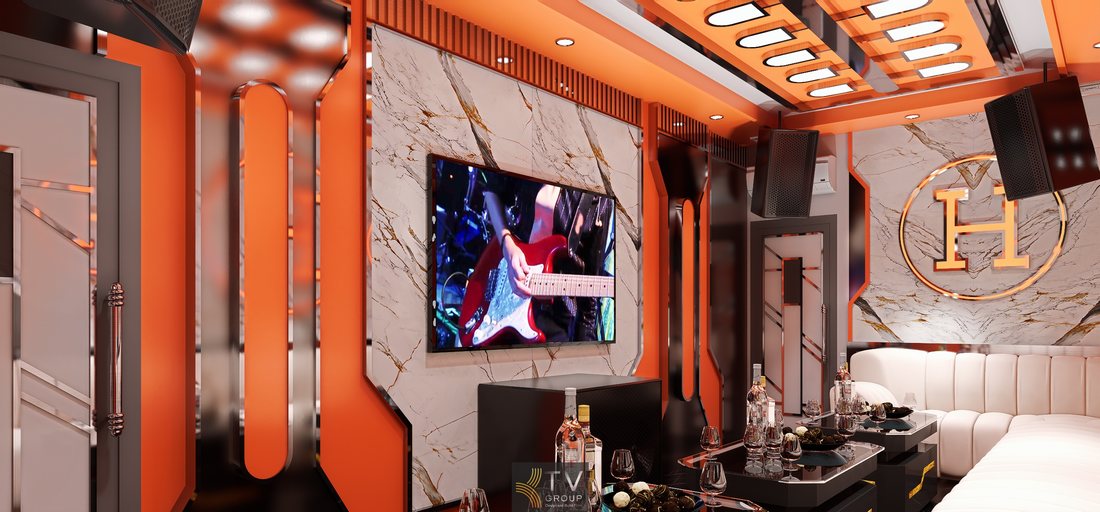 Thiết kế phòng karaoke Hermès Paris tông cam nổi bật, kết hợp marble vân đá và chi tiết ánh kim sang trọng, tạo không gian KTV cao cấp phù hợp kinh doanh tại TP.HCM.