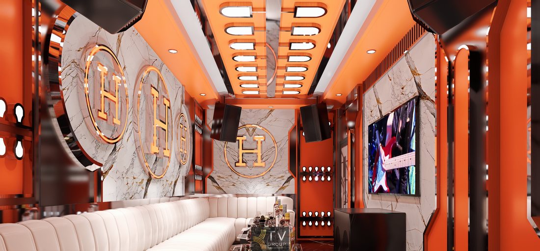 Thiết kế nội thất karaoke cao cấp tông cam kết hợp vật liệu marble và kim loại phản chiếu, tạo hiệu ứng ánh sáng đẹp mắt và thu hút khách hàng phân khúc cao cấp.