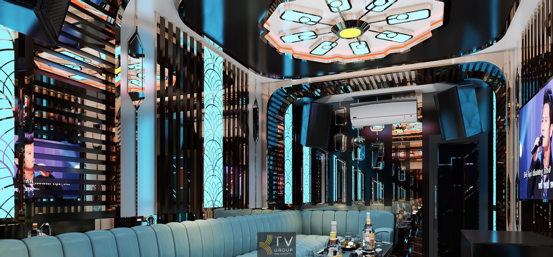 Thiết kế phòng karaoke Neo Art Deco sang trọng với sofa dài màu xanh ngọc, trần đèn nghệ thuật và hệ thống LED hiện đại, phù hợp mô hình karaoke KTV kinh doanh cao cấp tại Cà Mau thu hút khách hàng. 