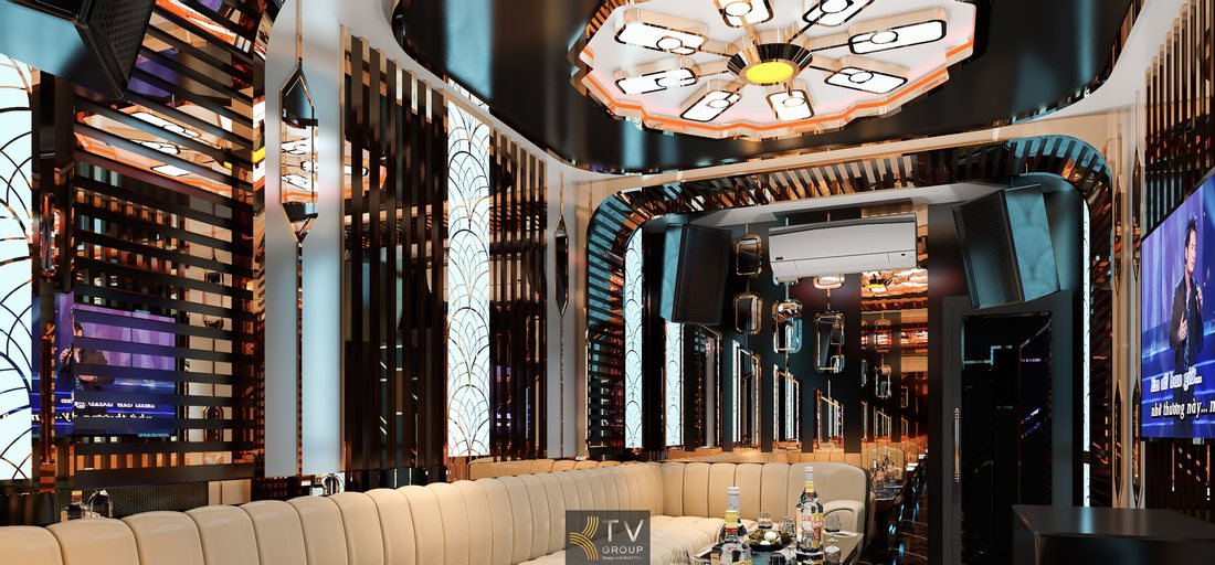 Không gian phòng karaoke KTV hiện đại với tường trang trí kim loại, ánh sáng LED nổi bật và màn hình karaoke lớn tạo trải nghiệm giải trí chuyên nghiệp cho quán karaoke tại Cà Mau. 