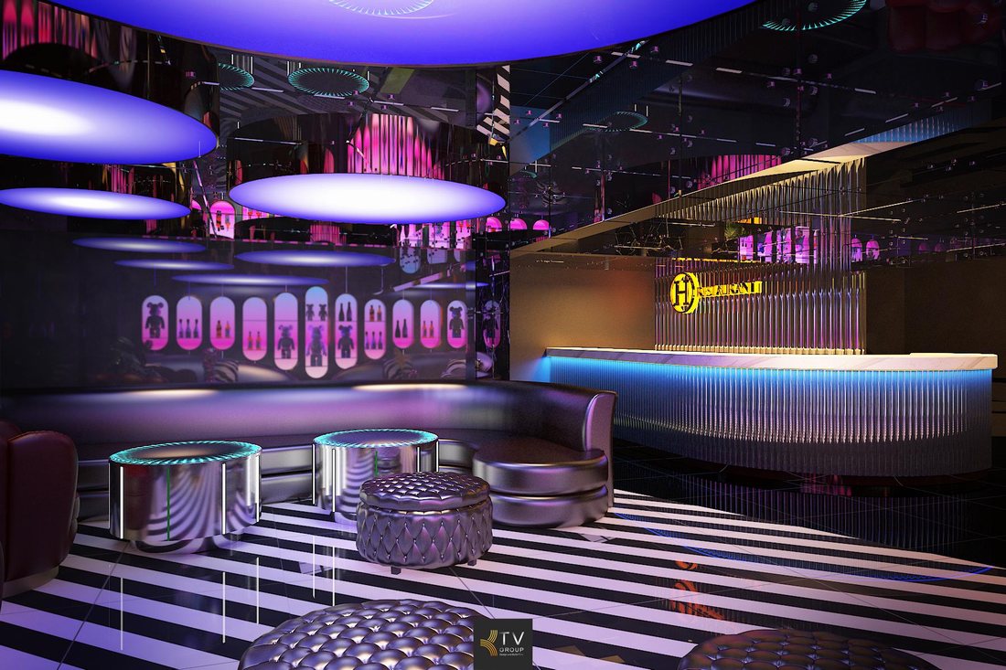 Thiết kế sảnh KTV cao cấp với tông tím neon, vật liệu ánh kim và bố cục mở tạo điểm nhấn thị giác mạnh trong mô hình karaoke kinh doanh.