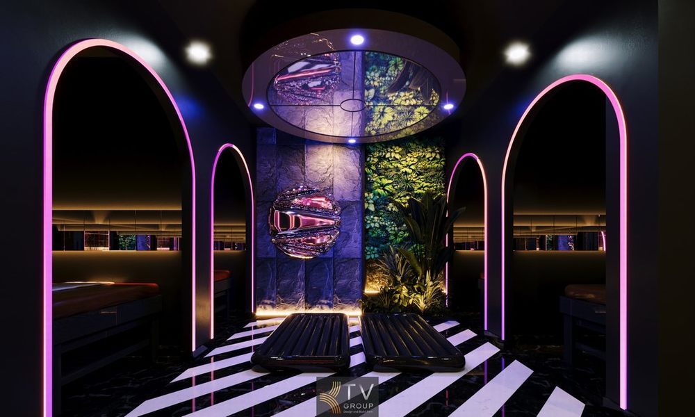 Phòng spa massage với bồn tắm lớn, ánh sáng đỏ neon và thiết kế hiện đại mang đến trải nghiệm thư giãn và giải trí đẳng cấp