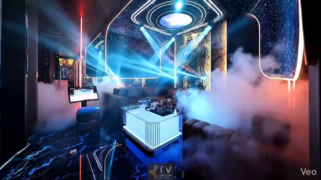 Phòng karaoke KTV phong cách tương lai với trần LED hình học, ánh sáng laser đa hướng và hiệu ứng khói sân khấu tạo không gian giải trí sống động, hiện đại, phù hợp mô hình kinh doanh karaoke cao cấp tại TP.HCM 