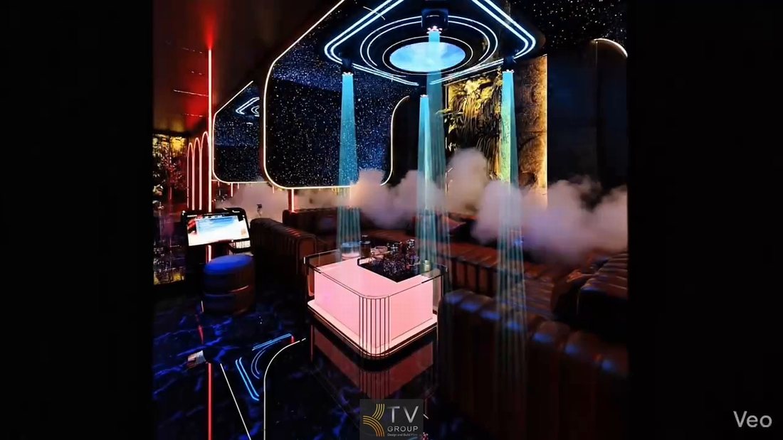Phòng karaoke hiện đại tại TP.HCM với bàn LED trung tâm, ghế sofa cao cấp và hệ thống ánh sáng laser chuyên nghiệp tạo không gian giống club thu nhỏ, giúp tăng khả năng thu hút khách hàng 