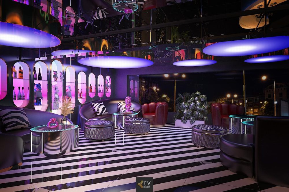 Mẫu phòng karaoke sang trọng với sofa dài, bàn karaoke hiện đại và hệ thống ánh sáng trang trí phù hợp quán karaoke kinh doanh. 