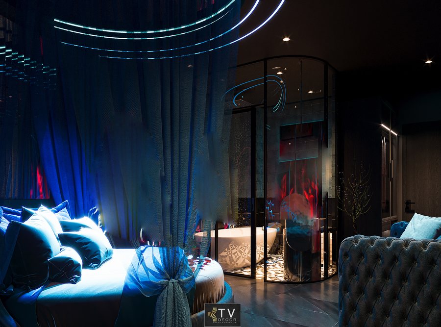 Phòng khách sạn lãng mạn với giường tròn, màn rèm xanh và ánh sáng LED hiện đại