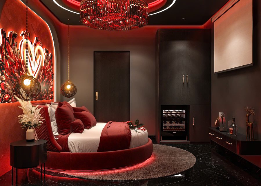 Thiết kế thi công phòng khách sạn nghệ thuật với giường tròn, mảng tường đôi chim phối ánh sáng đỏ – không gian ấn tượng và đầy cảm xúc