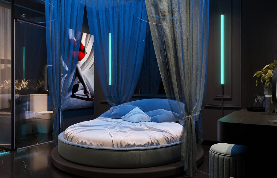 Thiết kế phòng khách sạn chủ đề Midnight Blue Glow với giường tròn và ánh sáng LED xanh hiện đại. 1