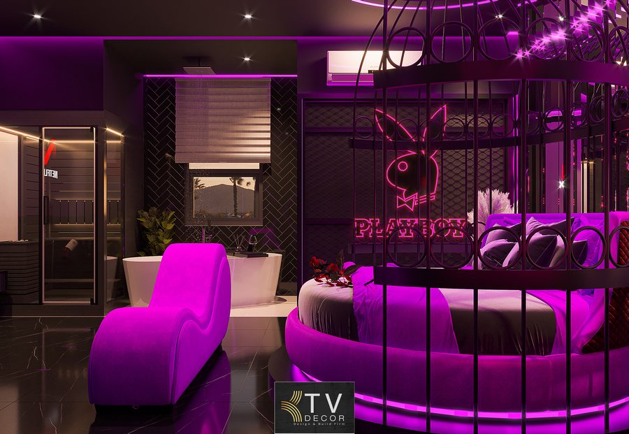 Thiết kế thi công phòng khách sạn chủ đề tình yêu phong cách Futuristic Glam với ánh sáng neon tím, giường trung tâm và bố cục hiện đại sang trọng 2
