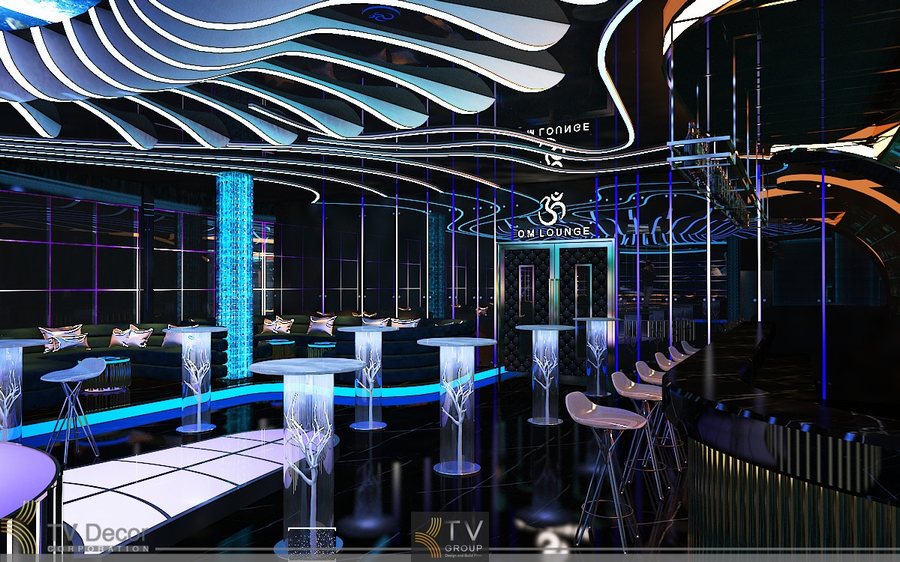 Thiết kế Lounge Bar tại Vũng Tàu được định hướng theo phong cách hiện đại, sang trọng, tập trung vào khu vực chỗ ngồi lounge rộng rãi, bố cục thoáng và giàu trải nghiệm. Không gian được tổ chức theo mô hình mở, các dãy sofa dài, ghế lounge thấp kết hợp bàn trung tâm tạo cảm giác thư giãn, riêng tư nhưng vẫn kết nối với khu bar và sân khấu DJ. 