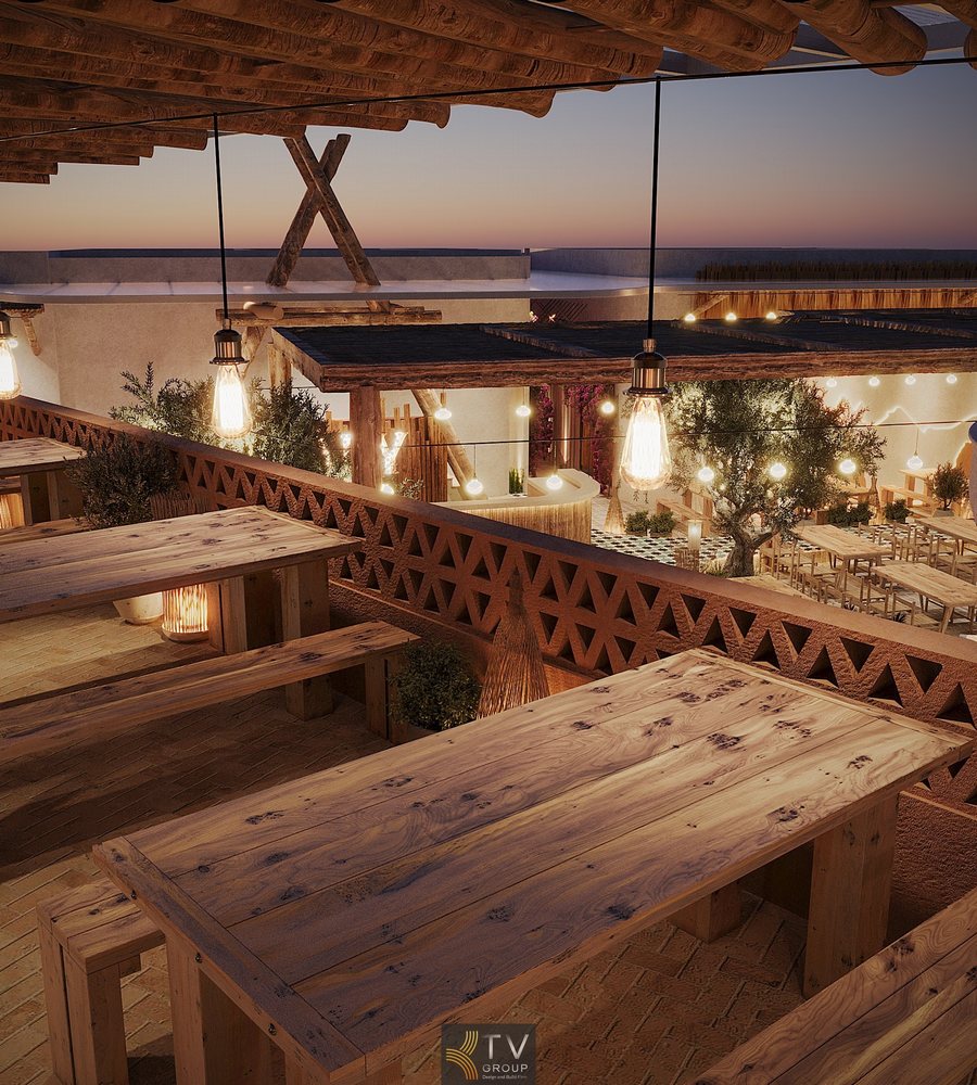 Không gian Thiết Kế Thi Công Beer Garden Trần Phú Nha Trang mở rộng trên tầng cao, nổi bật với bàn ghế gỗ mộc chắc chắn, mái pergola thô và lan can họa tiết thủ công. Ánh đèn treo vàng ấm hòa cùng cây xanh và tầm nhìn thoáng đãng, tạo nên trải nghiệm beer garden ngoài trời phóng khoáng, thư giãn, đậm chất 