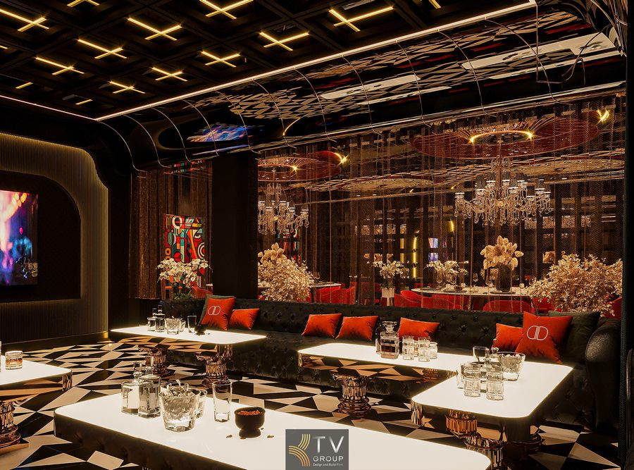 Không gian phòng VIP nhà hàng sử dụng trần gương uốn cong kết hợp ánh sáng vàng ấm mang lại hiệu ứng chiều sâu và vẻ đẹp đẳng cấp trong phong cách Dark Glam.