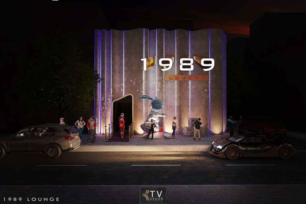 Thiết kế mặt tiền 1989 Lounge phong cách hiện đại về đêm, có đèn LED tím, mô hình phi hành gia, do KTV DECOR thực hiện.