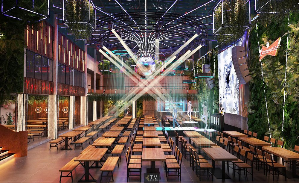Thiết kế nội thất nhà hàng Beer Food Garden với sàn trình diễn trung tâm, mảng tường cây xanh và đèn trần hiện đại – Dự án thực hiện bởi KTV DECOR