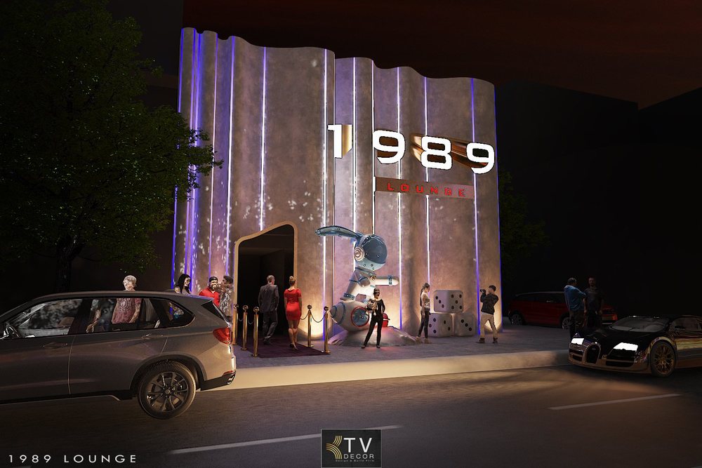 Mặt tiền 1989 Lounge với thiết kế đèn LED tím, mô hình phi hành gia, kiến trúc uốn lượn hiện đại do KTV DECOR thực hiện.